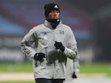 Tosin Adarabioyo warms up for Fulham in November 2020
