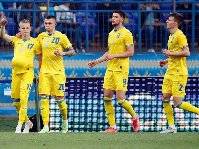 Ukraine's Oleksandr Zinchenko celebrates scoring their second goal with teammates on June 7, 2021
