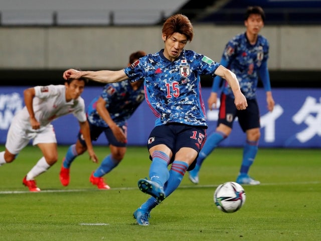 Japan's Yuya Osako scores their third goal from the penalty spot on May 28, 2021