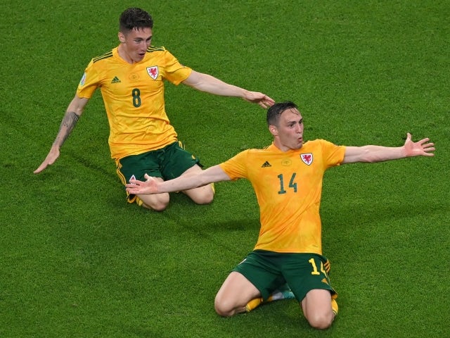Wales' Connor Roberts celebrates scoring their second goal with Harry Wilson on June 16, 2021