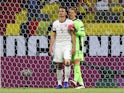 Germany's Mats Hummels is consoled by teammate Manuel Neuer after scoring an own goal on June 15, 2021