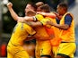 Hartlepool United's Ryan Donaldson celebrates with teammates after the match on June 13, 2021