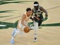 Atlanta Hawks guard Trae Young drives to the basket against Milwaukee Bucks guard Jrue Holiday on June 24, 2021