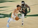 Atlanta Hawks guard Trae Young drives to the basket against Milwaukee Bucks guard Jrue Holiday on June 24, 2021