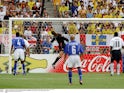 Ronaldinho scores for Brazil over England's David Seaman at the 2002 World Cup on June 21, 2002