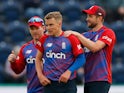 England's Sam Curran celebrates with teammates after taking the wicket of Sri Lanka's Dasun Shanaka on June 23, 2021