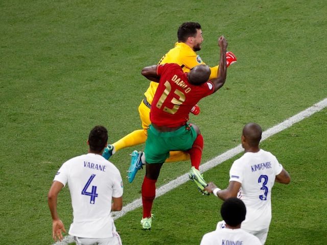 Portugal's Danilo Pereira is challenged by France's Hugo Lloris at Euro 2020 on June 23, 2021