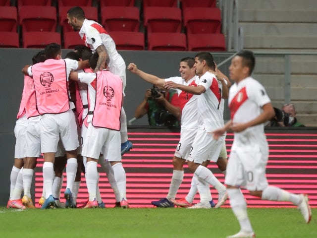 Peru's Andre Carrillo celebrates scoring their first goal with teammates on June 27, 2021
