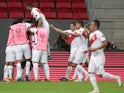 Peru's Andre Carrillo celebrates scoring their first goal with teammates on June 27, 2021
