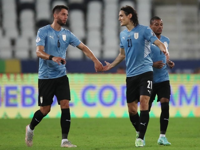 Uruguay's Edison Cavani celebrates scoring their first goal with Rodrigo Bentancur on June 29, 2021