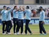 England's Chris Woakes celebrates with teammates against Sri Lanka on July 4, 2021