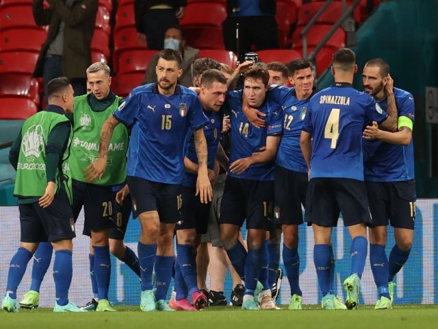 Italy's Federico Chiesa celebrates scoring their first goal with teammates on June 26, 2021