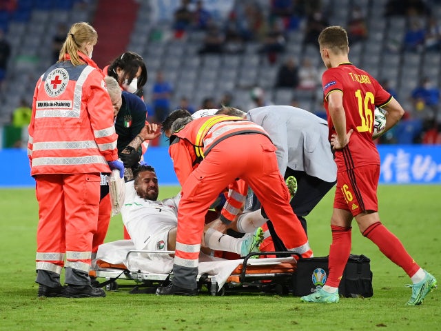 Italy's Leonardo Spinazzola goes down injured against Belgium at Euro 2020 on July 2, 2021