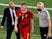 Belgium's Kevin De Bruyne with Belgium coach Roberto Martinez after being substituted after sustaining an injury on June 27, 2021