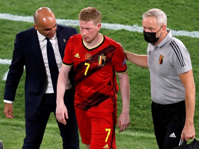 Belgian Kevin De Bruyne with Belgian coach Roberto Martinez after being substituted following injury on June 27, 2021