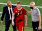 Belgium's Kevin De Bruyne with Belgium coach Roberto Martinez after being substituted after sustaining an injury on June 27, 2021