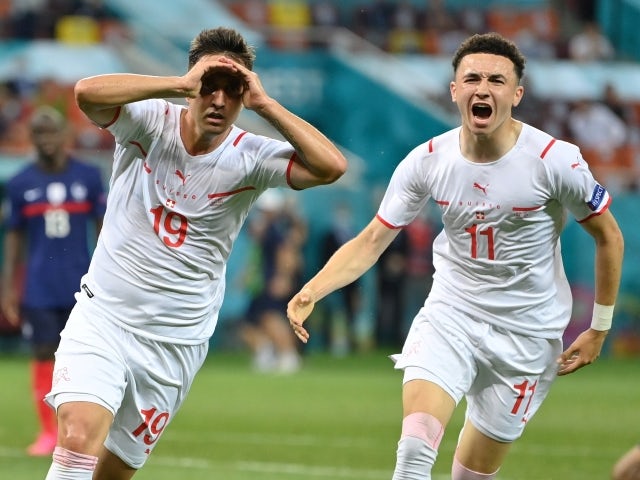 Switzerland's Mario Gavranovic celebrates scoring their third goal with Ruben Vargas on June 28, 2021