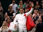 Roger Federer celebrates at Wimbledon on June 29, 2021