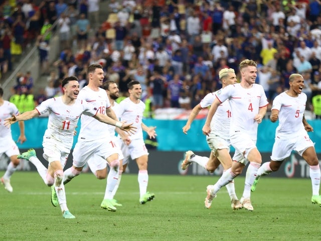 Switzerland players celebrate after winning the penalty shoot-out on June 28, 2021