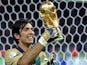 Italy goalkeeper Gianluigi Buffon celebrates with the 2006 World Cup trophy