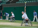 Britain's Alfie Hewett and Gordon Reid in action during the men's wheelchair doubles final at Wimbledon on July 10, 2021