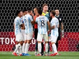 Patricio Perez of Argentina, Santiago Colombatto of Argentina and teammates remonstrate with the referee on July 22, 2021