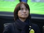 Japan head coach Asako Takakura stands for introductions before a game against England in the 2020 She Believes Cup soccer series at Red Bull Arena in May 2020