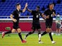 Germany forward Ragnar Ache (6) celebrates his goal with teammates during the second half against Brazil in Group D play during the Tokyo 2020 Olympic Summer Games at Nissan Stadium on July 22, 2021