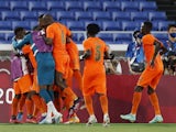 Franck Kessie of Ivory Coast celebrates scoring their second goal with teammates on July 22, 2021