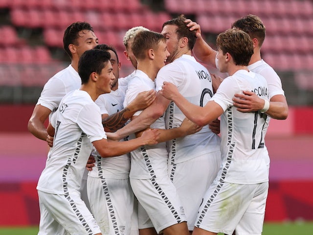Chris Wood of New Zealand celebrates scoring their first goal with teammates on July 22, 2021