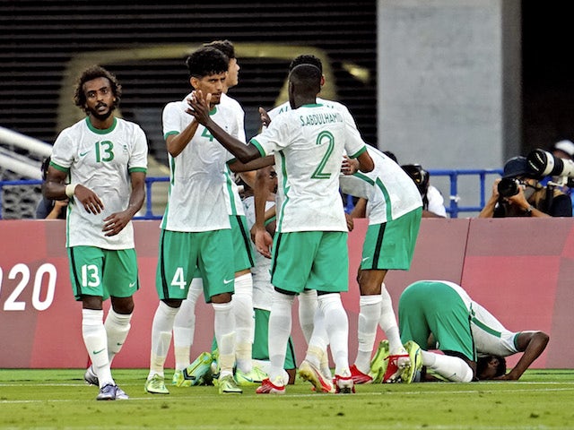 Saudi Arabia celebrates after an goal by midfielder Yasser Alshahrani (13) during the first half against the Ivory Coast in Group D play during the Tokyo 2020 Olympic Summer Games at Nissan Stadium on July 22, 2021