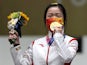 Gold medallist Yang Qian of China celebrates on the podium on July 24, 2021