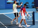 Alexander Zverev of Germany with Novak Djokovic of Serbia after winning his semifinal match at the Tokyo 2020 Olympics on July 30, 2021