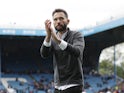 Huddersfield Town manager Carlos Corberan applauds the fans after the match on August 1, 2021