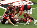 Flamengo's Bruno Henrique celebrates scoring their third goal with Filipe Luis and teammates on August 1, 2021