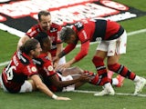 Flamengo's Bruno Henrique celebrates scoring their third goal with Filipe Luis and teammates on August 1, 2021
