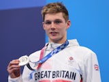 Duncan Scott poses with his silver medal on July 30, 2021