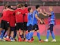 Japan players celebrate after winning the penalty shoot-out on July 31, 2021