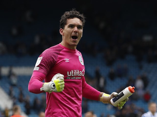 Huddersfield Town's Lee Nicholls celebrates after the penalty shootout on August 1, 2021