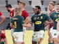South Africa's Lukhanyo Am celebrates scoring their second try with Faf De Klerk against the Lions on July 31, 2021