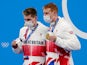 Tom Dean and Duncan Scott celebrate with their medals during the medals ceremony for the men's 200m freestyle during the Tokyo 2020 Olympic Summer Games