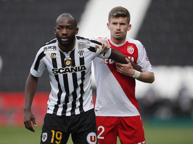 Angers' Stephane Bahoken in action with AS Monaco's Caio Henrique in Ligue 1 in April 2021