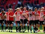 Brentford players celebrate after winning the Championship Play-Off Final pictured May 29, 2021