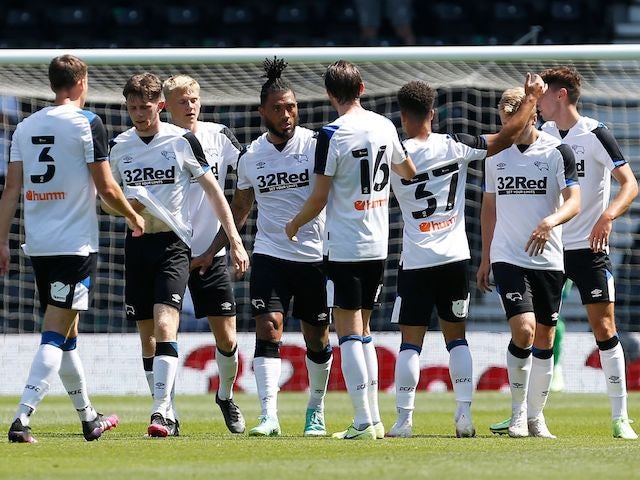 Derby County's Colin Kazim-Richards celebrates with teammates after scoring their first goal on July 18, 2021