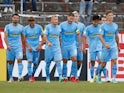 SC Freiburg's Jonathan Schmid celebrates scoring their first goal with teammates on August 8, 2021