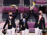 Great Britain's equestrian team celebrates winning Eventing gold at the Tokyo 2020 Olympics on August 2, 2021 