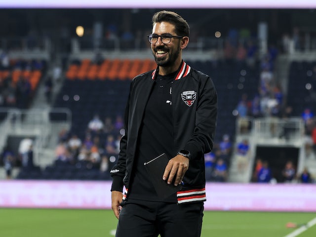 DC United head coach Hernan Losada smiles as he walks off the field after the against FC Cincinnati in the first half at TQL Stadium on July 31, 2021