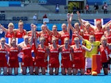 Players of Great Britain's women's team pose for a group photo after winning their match for bronze in hockey at the Tokyo Olympics