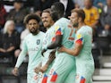 Huddersfield Town's Mouhamadou-Naby Sarr celebrates scoring their first goal with teammates on August 7, 2021
