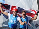John Gimson of Britain and Anna Burnet of Britain celebrate winning silver after the race on August 3, 2021
